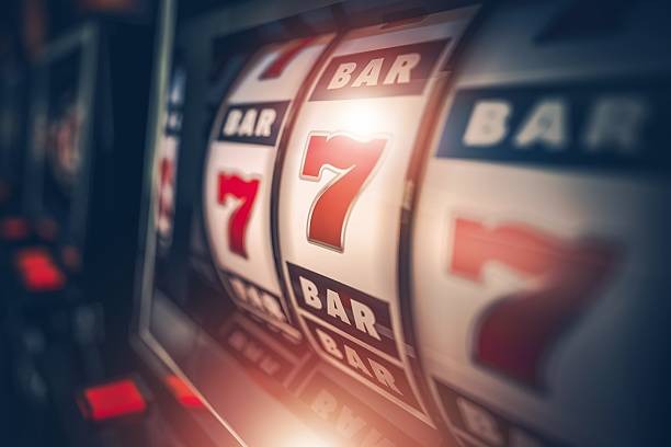 Slot game spinning on a mobile phone screen with bet controls visible